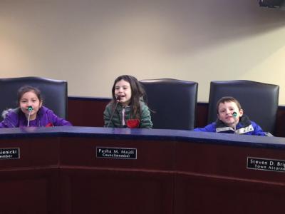 Students sitting at the town council